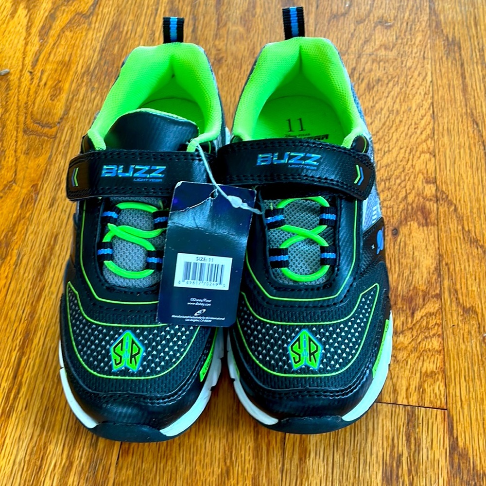 Boys, size 11, light up sneakers. Never worn with tag.